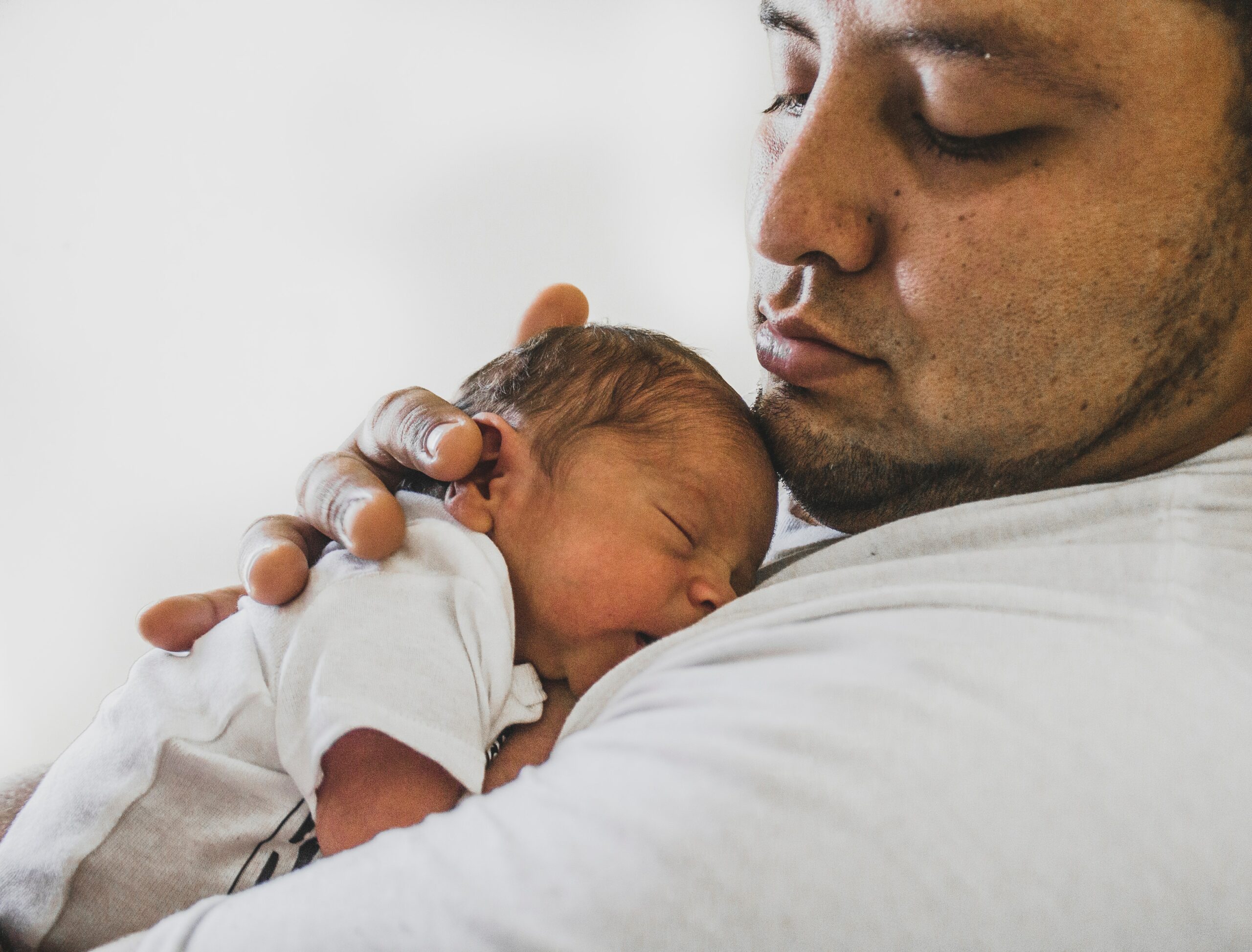 newborn baby and father